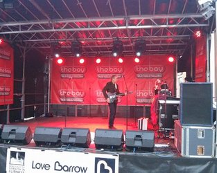 Andy Wills as Brian May sound check before Lancaster Christmas Lights Switch On